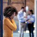 Woman in distress in the workplace.