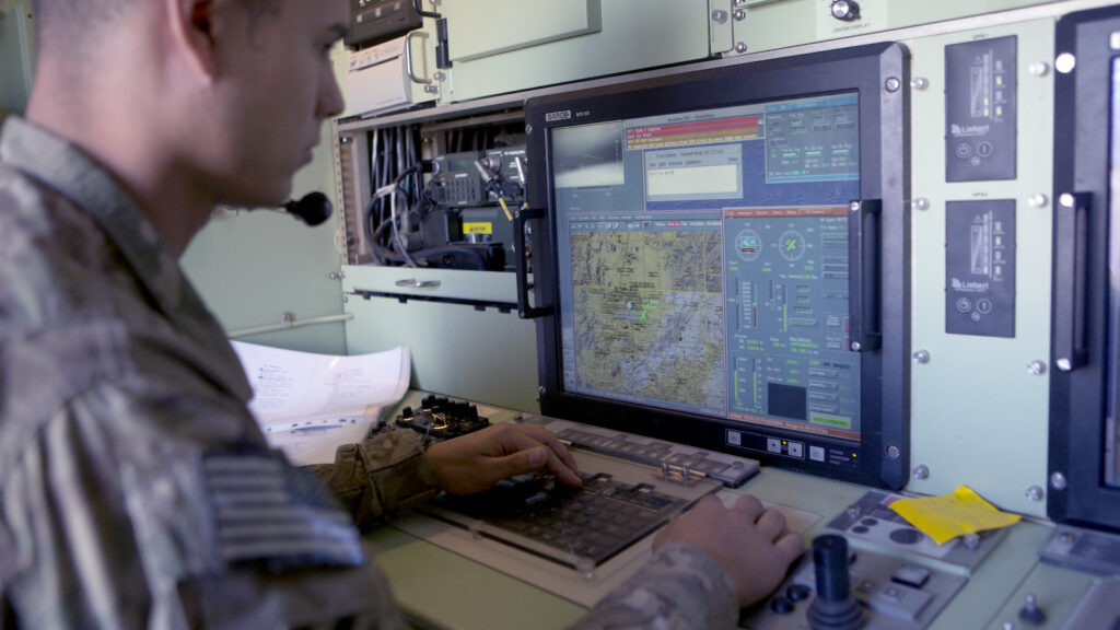 A US Army soldier monitors a US Army 14' Shadow surveillance