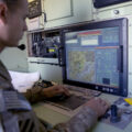 A US Army soldier monitors a US Army 14' Shadow surveillance