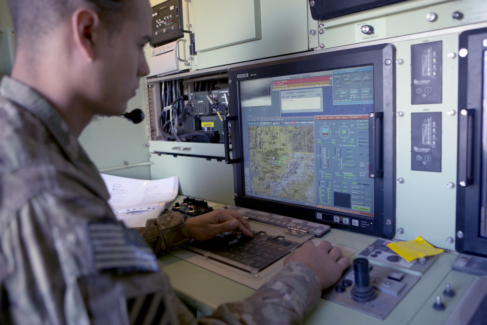 A US Army soldier monitors a US Army 14' Shadow surveillance
