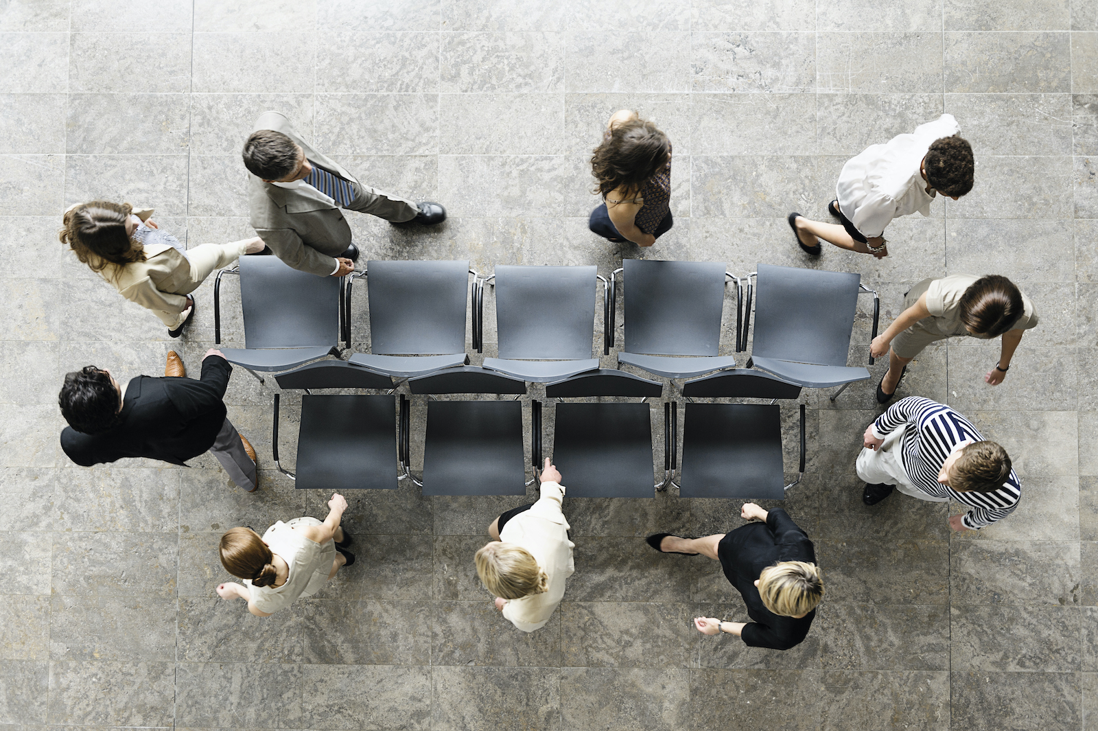 Business people playing musical chairs