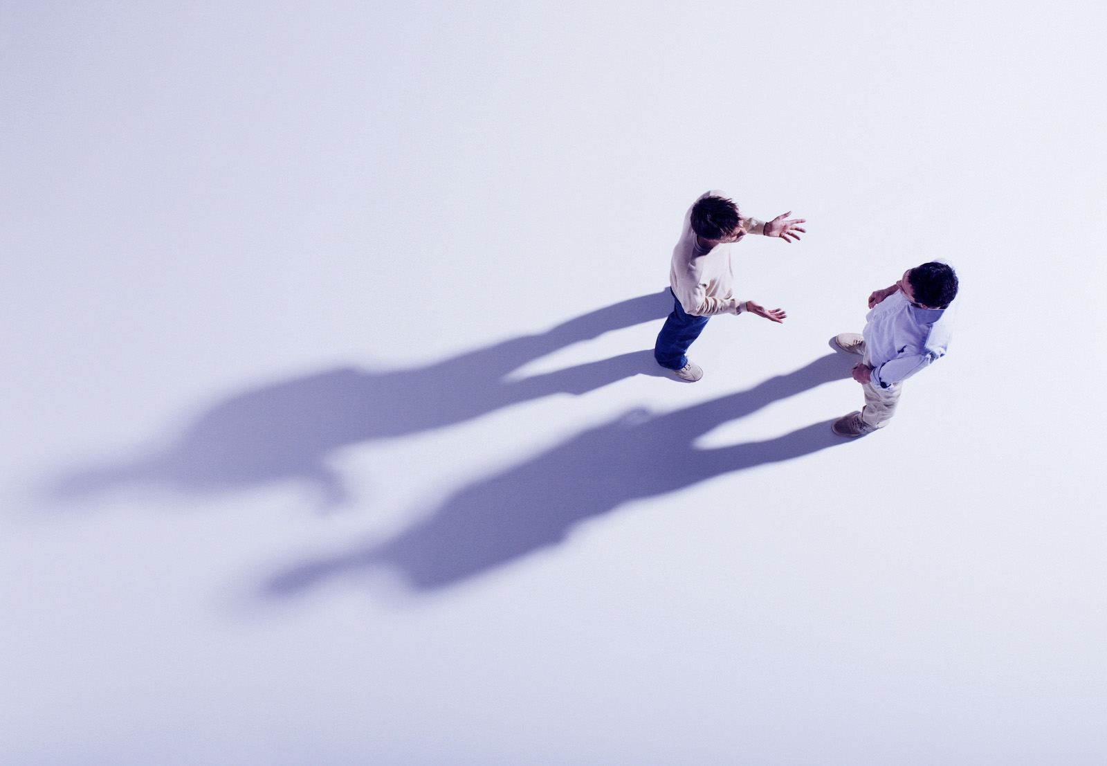 Two men having discussion, overhead view