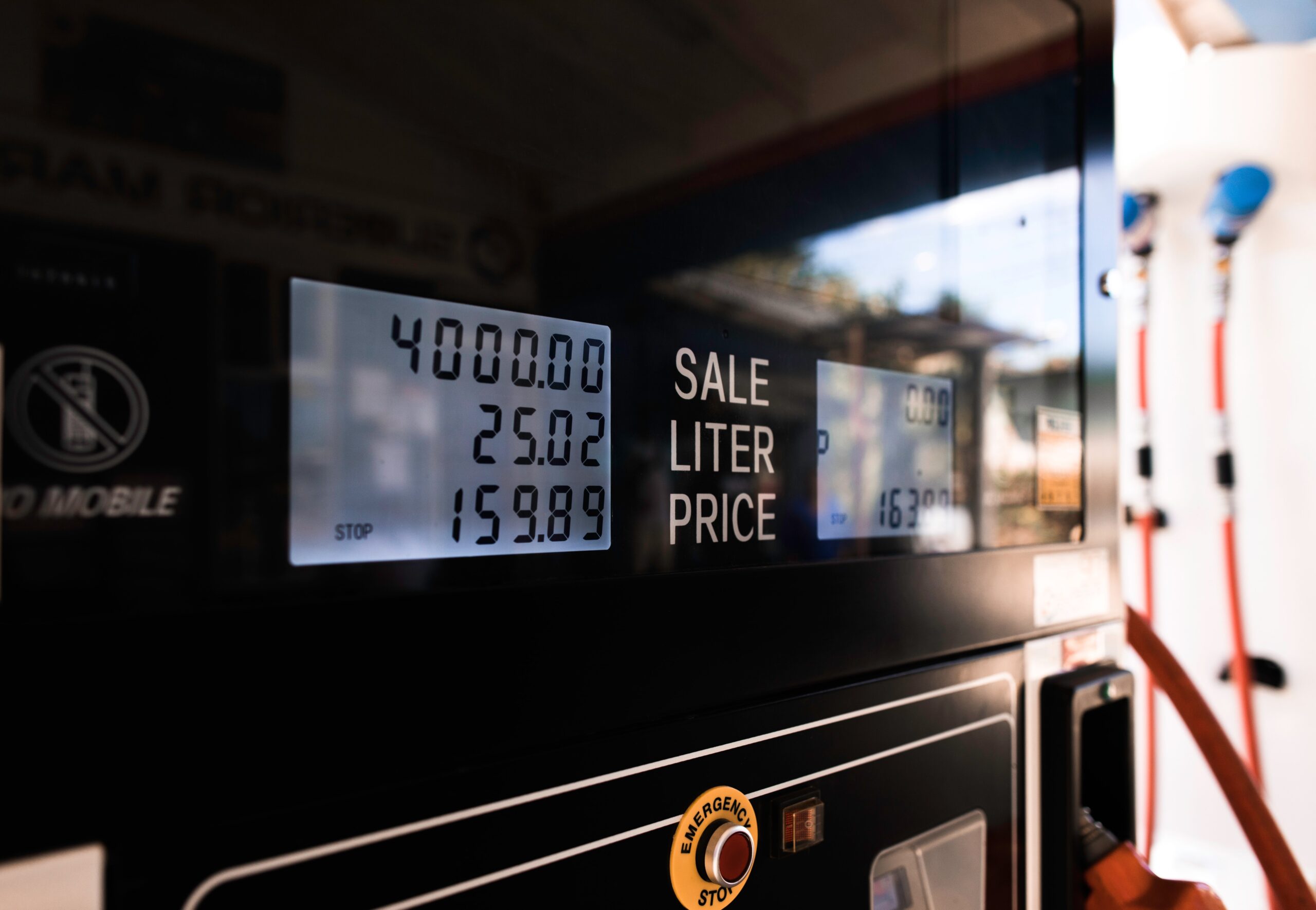 A close-up of the screen of a gas pump showing the cost of a recent sale. The numbers show the high price of 159 pence per liter of gas.
