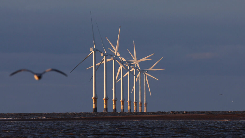 Wind turbines generate electricity at Burno Bank Off Shore Wind Farm on December 07, 2022 in Liverpool, England