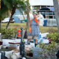 Jane Cihon sorts through family photos damaged by storm surge from Hurricane Ian on October 2, 2022