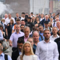 Commuters cross London Bridge during the morning rush hour on August 17, 2022 in London, England.