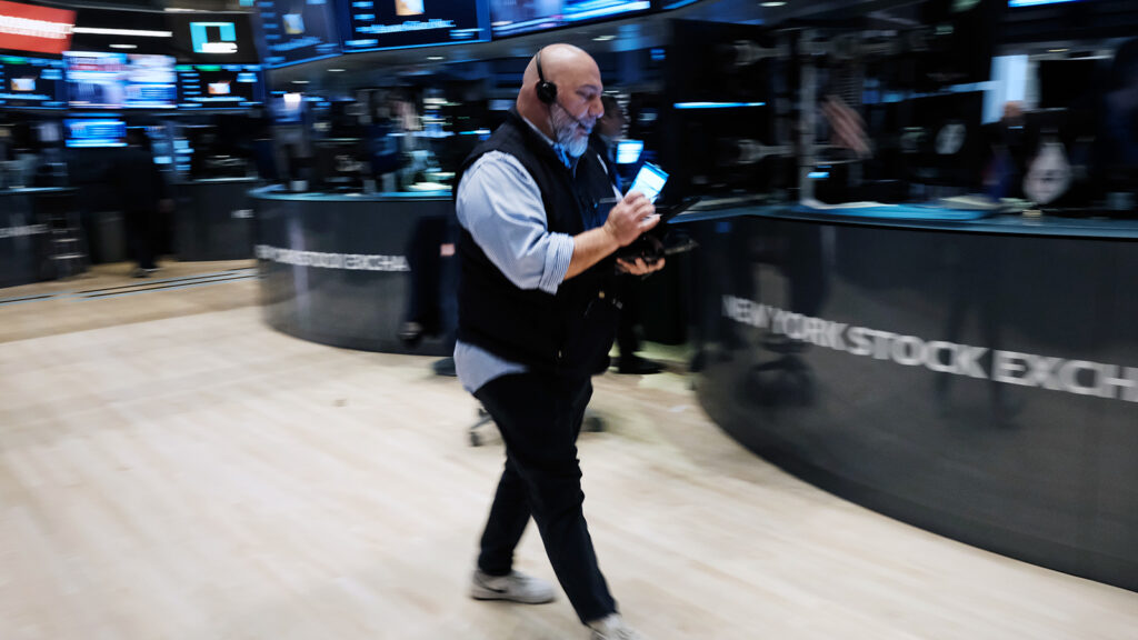 Traders work on the floor of the New York Stock Exchange