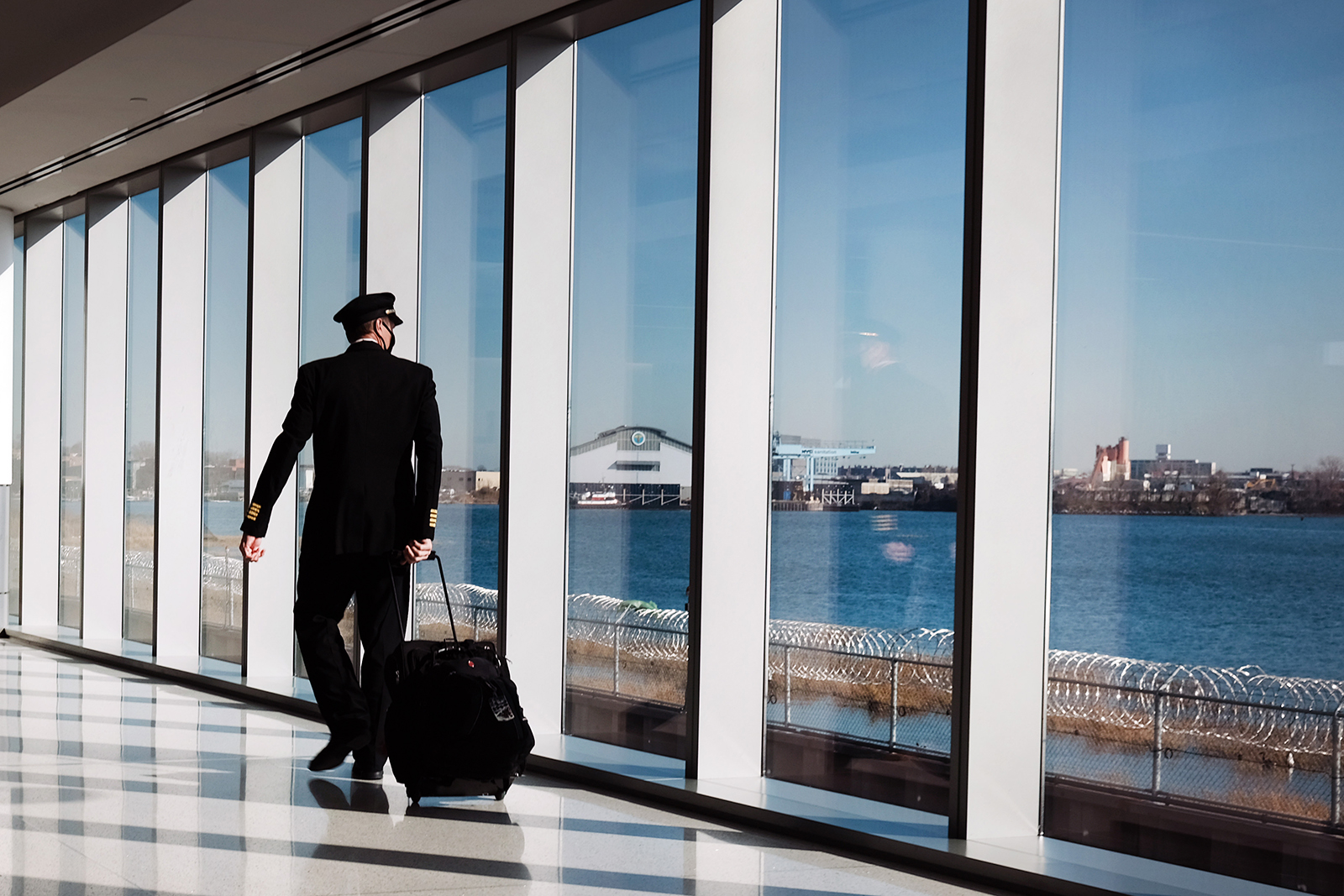 A pilot moves through New York's LaGuardia Airport